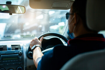 Man fast driving a car on the way in the morning with selective focus.