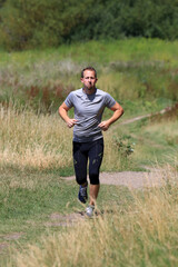 Fototapeta premium Cooler, sportlicher, junger Mann beim Joggen