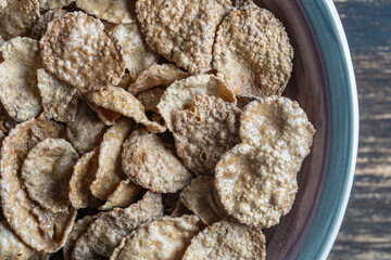 Whole grain glazed flakes in plate. Healthy breakfast, whole grain muesli in a bowl