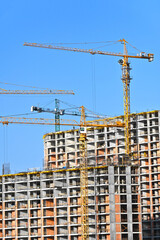 Crane and highrise construction site