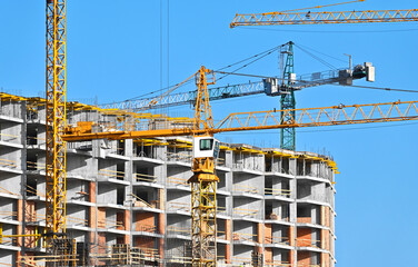 Crane and highrise construction site