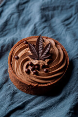 Chocolate Cannabis Tart with marijuana leaf. Delicious infused dessert cake for special occasion, valentines day treat, Christmas, thanksgiving.