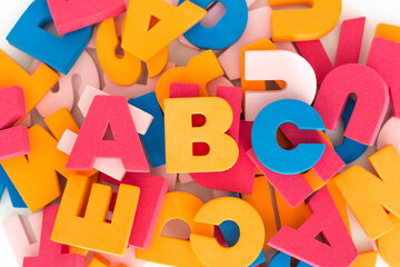 Background of multicolored stacked and messy letters