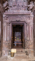 Bagalakote, Karnataka, India - November 7, 2013: Bagalakote, Karnataka, India - November 7, 2013: Pattadakal temple complex. Look through extensively sculpted entrance door to inner sanctum upon decor