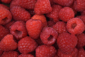 Overhead close-up of a pile of fresh raspberries 