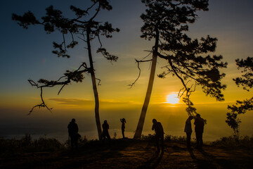 Silhouette Tourists on Pha Nok Aen Phukradueng, Thailand in the morning.