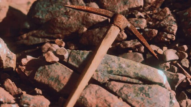 retro pickax on the rocks