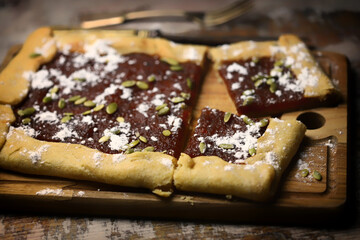 Soft focus. Homemade square galette with confiture.