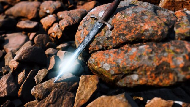 old dagger on the rock at sunset