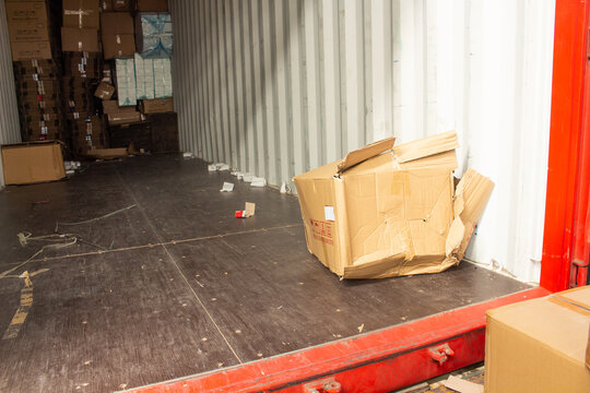 unloading carton from container and carton damage from loading or transport process. 