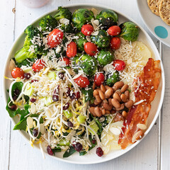 Flat lay view of a very healthy homemade green salad plate with high protein