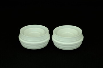 Medicine bottle cap on black background , From injection molding machines In plastic factories