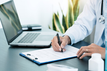 Doctor hand holding pen writing patient history list on clipboard about medication and treatment.