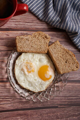 fried eggs with two slices of bread