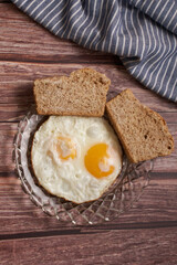 fried eggs with two slices of bread