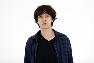 Portrait of young Asian teen man in casual clothing on white background