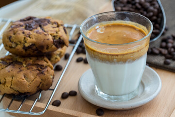 Coffee with condensed milk. Coffee with condensed milk in a transparent glass. Vietnamese coffee with condensed milk in glass cups. Traditional method of making of Vietnamese coffee