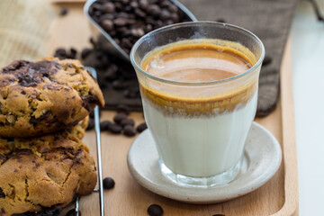 Coffee with condensed milk. Coffee with condensed milk in a transparent glass. Vietnamese coffee with condensed milk in glass cups. Traditional method of making of Vietnamese coffee