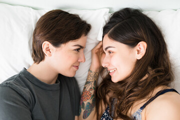 Fototapeta na wymiar LGBT lesbian women feeling happy after waking up