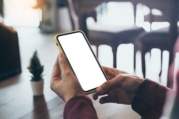 cell phone blank white screen mockup.woman hand holding texting using mobile on desk at office.background empty space for advertise.work people contact marketing business,technology