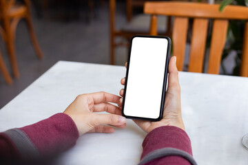 cell phone blank white screen mockup.woman hand holding texting using mobile on desk at office.background empty space for advertise.work people contact marketing business,technology