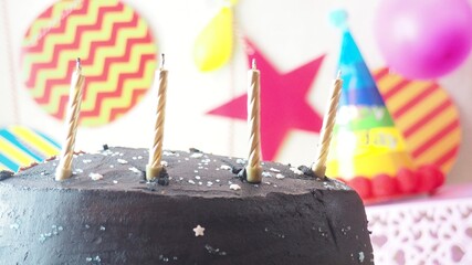 Chocolate birthday cake with candles. light and blow out candles
