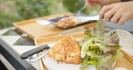 Fresh homemade French Croissant with vegetables salad on the table , morning breakfast meal