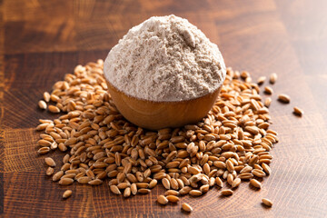 Spelt Flour in a Wooden Bowl on a Wooden Butchers Block