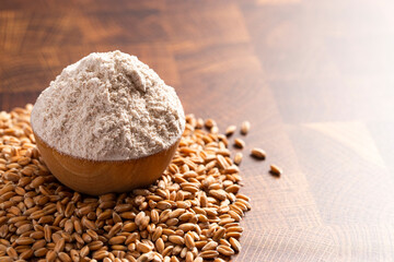 Spelt Flour in a Wooden Bowl on a Wooden Butchers Block