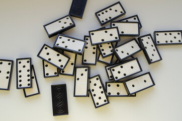 dominoes scattered on white background