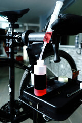 bleeding brake system bicycle MTB defocused workshop background