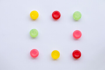 colorful sough sore pastille pills from herbal arrangement  flat lay square style on background white