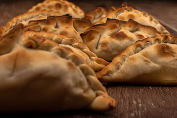 Traditional Argentinean empanadas pie on table, meat Chicken and vegetables