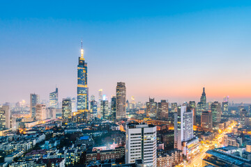 Fototapeta na wymiar Night view of Zifeng Building and city skyline in Nanjing, Jiangsu, China 