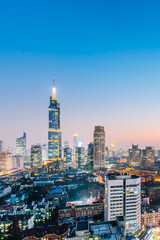 Fototapeta na wymiar Night view of Zifeng Building and city skyline in Nanjing, Jiangsu, China 