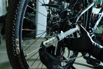 Fototapeta premium Tubeless liquid injection in MTB bicycle wheel
