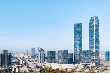 Fototapeta na wymiar Sunny view of Kunming twin towers and city skyline in Yunnan, China 