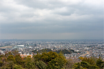 Fototapeta na wymiar Distant view of Nishinomiya city, Osaka city from Kabutoyama forest park in Nishinomiya, Hyogo, Japan