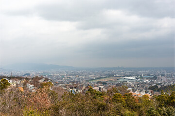 Fototapeta premium Distant view of Nishinomiya city, Osaka city from Kabutoyama forest park in Nishinomiya, Hyogo, Japan