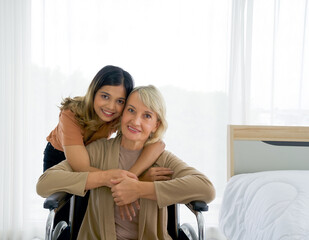 Happy mix skin family living together, adopted asian daughter  cuddle caucasian mother sitting on a...