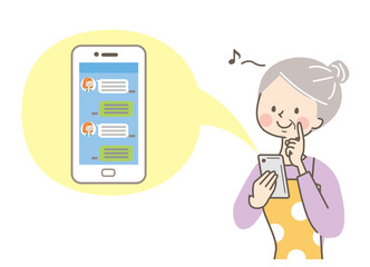 スマホでメール操作をするシニア女性