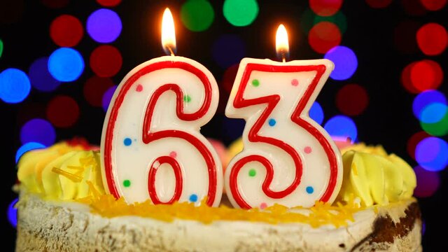 Number 63 Happy Birthday Cake With Burning Candles Topper.