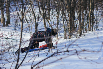 A cute ten years old girl having fun on snow tube on a winter day. Wintertime, entertainment, activity, childhood, holidays concept.	