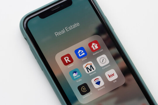 Portland, OR, USA - Feb 2, 2021: Assorted real estate apps are seen on an iPhone, including Redfin, Zillow, Realtor.com, Trulia, Movoto, Compass, Century 21, RE/MAX, and KW.