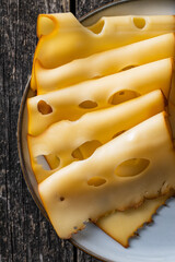 Sliced smoked hard cheese.