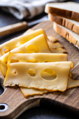 Sliced smoked hard cheese.