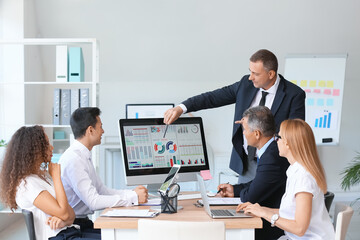 Businessman giving presentation in office