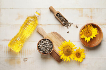 Composition with sunflower oil on wooden background