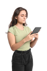 Fototapeta premium Young woman with e-reader on white background
