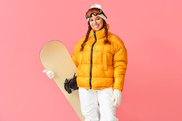 Female snowboarder on color background